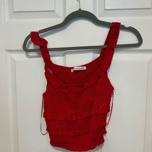Red Cropped ruched top. Size small. In very good condition.